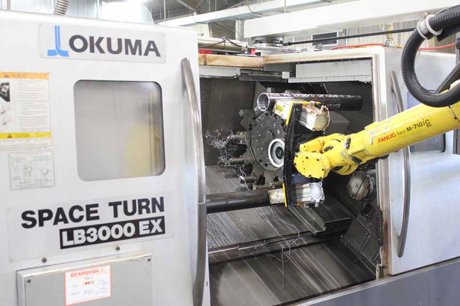 Robot working inside an Okuma CNC lathe