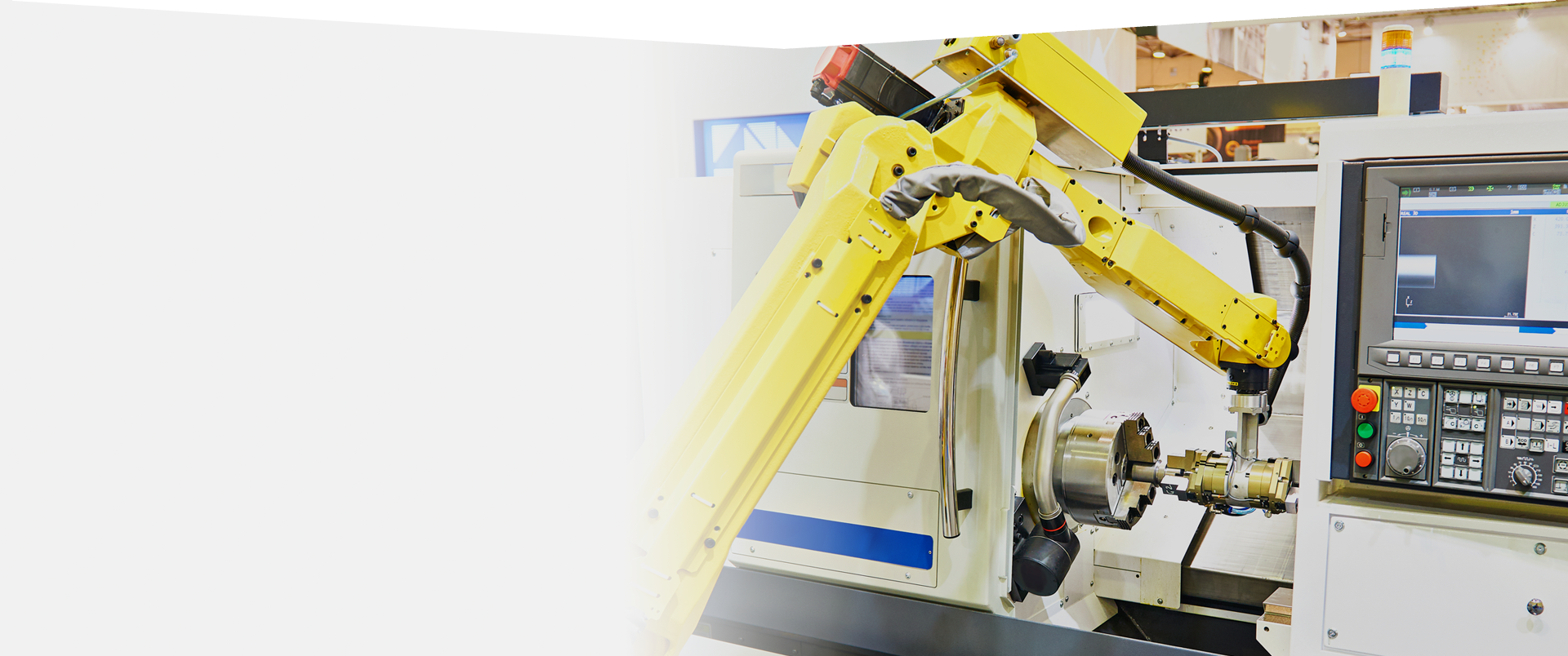 Robot arm tending a CNC lathe